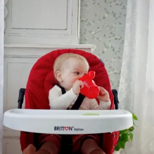 Baby drinking from the Britton red non-spill cup