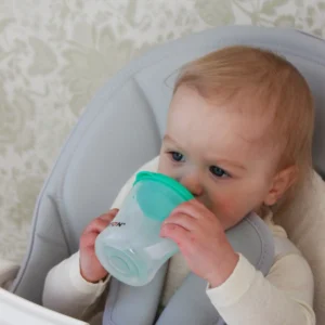 Baby drinking from the Britton First Cup 200 ml green