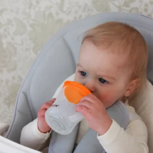 Baby drinking from the Britton First Cup 200 ml orange
