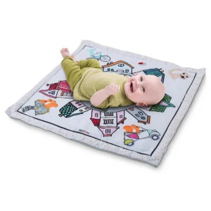 Baby lying on the Britton Dery play mat