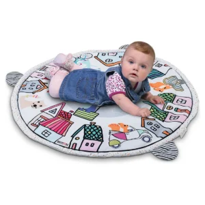 Baby lying on the Britton Ely play mat