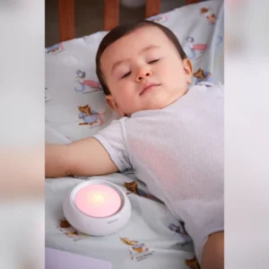 Bebcare Hear baby unit beside a sleeping baby
