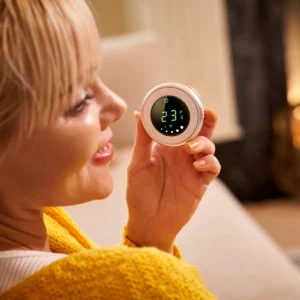 Parent using the Bebcare Hear audio monitor parent unit